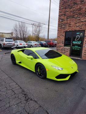 Lamborghini Huracán with full ceramic window tint parked outside Ghost Industries building in Chicago