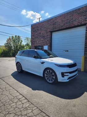 White Range Rover Sport with ceramic window tint parked outside Diamond Window Tinting Chicago